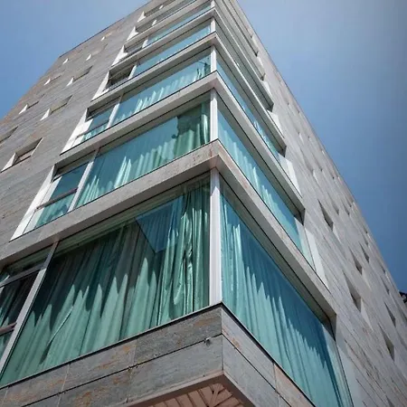 Exe Puerta San Pedro 3* לוגו