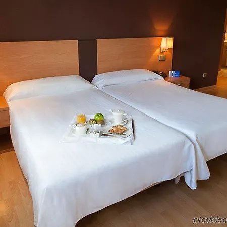 Exe Puerta San Pedro מלון לוגו