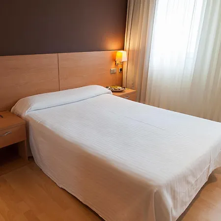 Exe Puerta San Pedro מלון לוגו